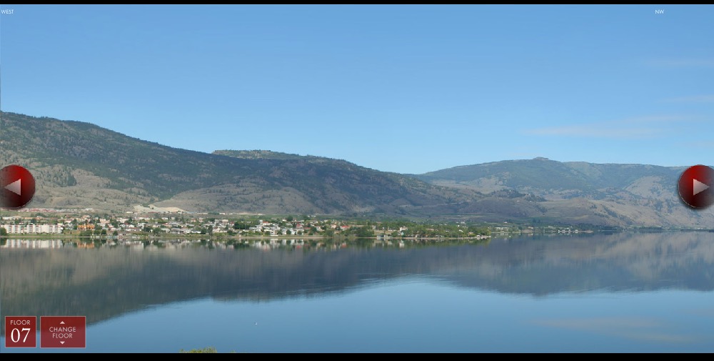 The Indigo view study: a panoramic photograph of Osoyoos Lake and the surrounding hills, with a floor selector reading Floor 07 and left and right arrows to rotate the view.